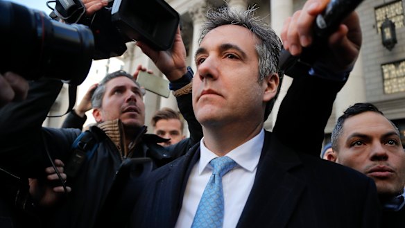 Michael Cohen walks out of federal court.