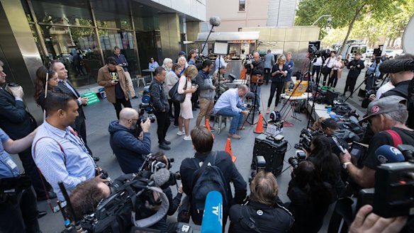 A man who goes by the name Michael Advocate sat outside the court, surrounded by media, listening to Judge Peter Kidd.