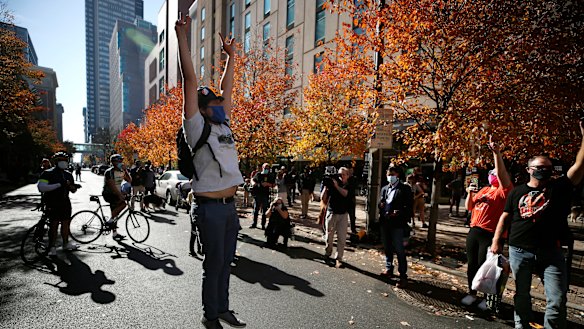 People celebrate outside the Pennsylvania Convention Centre after Democrat Joe Biden defeated President Donald Trump to become 46th president of the United States.