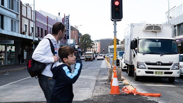 Military Road's pedestrian safety fence has been removed. 