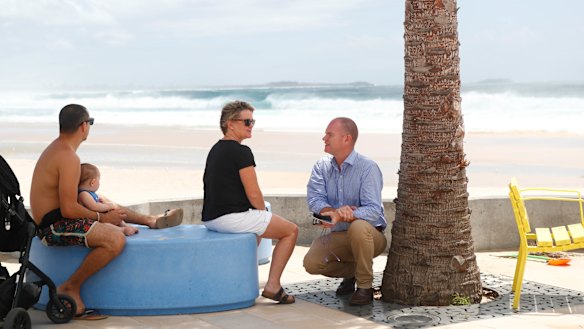 Labor candidate Craig Elliott talks with locals while campaigning 