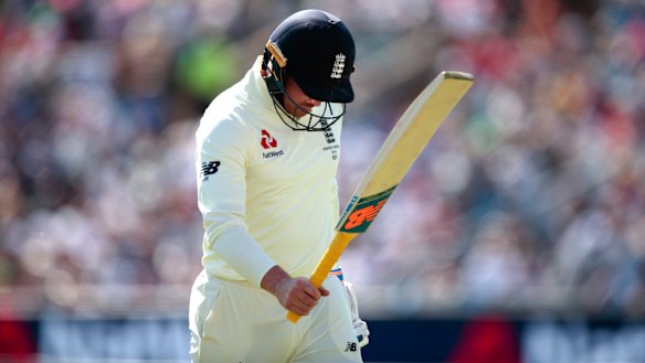 England's Jason Roy walks from he pitch after being bowled for 8 by Australia's Pat Cummins.