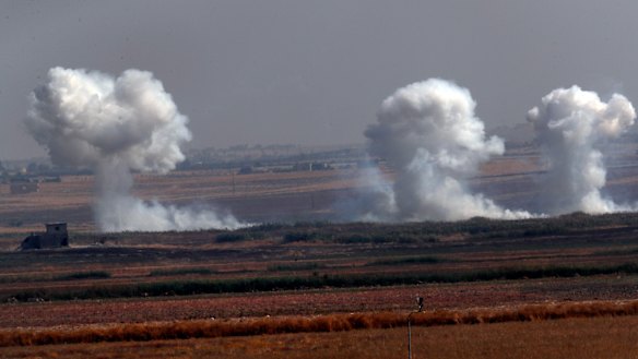 Smoke billows from targets inside Syria during bombardment by Turkish forces on Thursday.