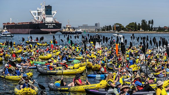 Climate protesters in kayaks attempt to block access to the Port of Newcastle in November 2024.