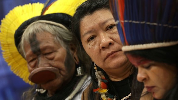 Kayapo tribe leader Raoni Metuktire, from left, Joenia Wapichana, the first Brazilian indigenous MP, and indigenous leader Sonia Guajajara meet with MPs earlier this year, to discuss land rights.