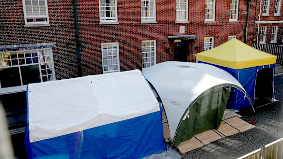 Tents set up by search teams are seen outside the John Baker House for homeless people in Salisbury as police continue their investigations.