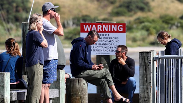 People comforting each other at Whakatane following the White Island volcano eruption.