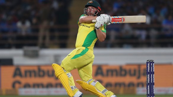 Aaron Finch goes over the top against India.