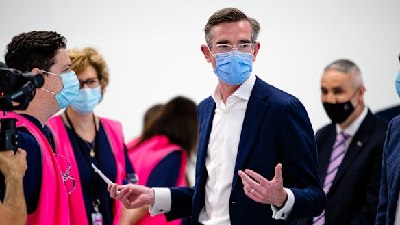 Booster push: NSW Premier Dominic Perrottet at the new Granville Centre vaccination clinic on Monday. 