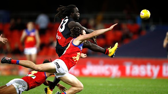 Tip top: Essendon's Anthony McDonald-Tipungwuti evades a smother to get a shot on goal.