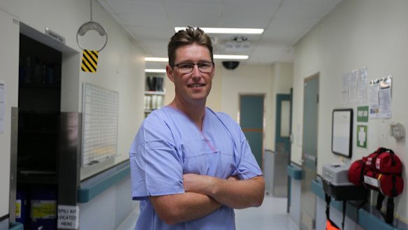 Queensland's youngest forensic pathologist Dr Christopher Day does a walk through the Queensland Forensic Services' mortuary.