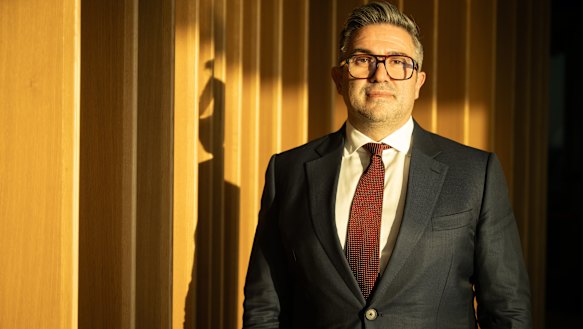 A shadow hovers over Lendlease boss Tony Lombardo as he executes a tactical retreat from the company’s overseas operations.