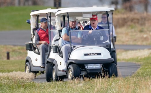 Donald Trump plays golf last month.