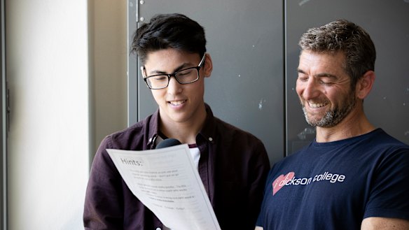 Jackson Houng auditioning to be the voice of Canberra's light rail with the help of teacher Lex Warfield.