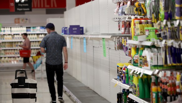 Empty toilet paper shelves at Coles supermarket. 