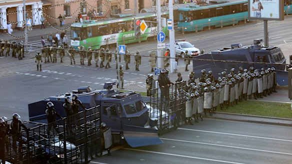 Police block the road during an opposition rally.