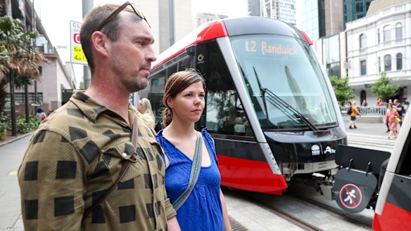 Glebe residents Tim and Franzi Mueller enjoyed their first trip on the light rail line but say it was 'just a little slow'. 