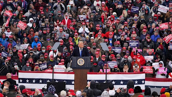 President Donald Trump speaks during a campaign rally in Lansing, Michigan. 