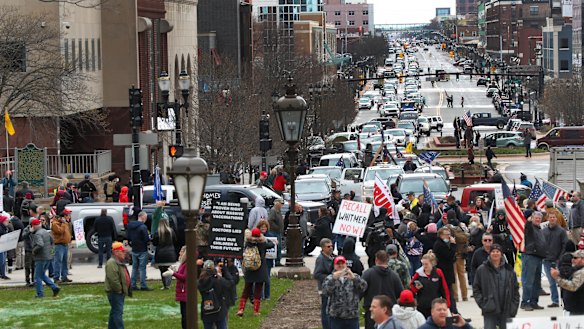Sick and tired: protesters gather at the Michigan State Capitol in Lansing, Michigan.