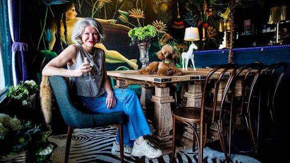 Sam Ford with her poodle Maximus inside Argyle Bar, which opened in The Rocks during the height of Sydney's lockdown measures.