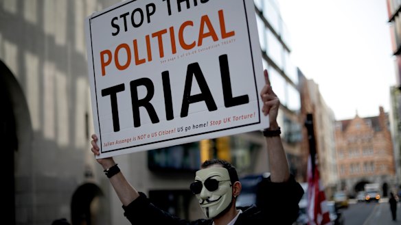 A supporter of WikiLeaks founder Julian Assange takes part in a protest outside the Central Criminal Court, the Old Bailey, in London.