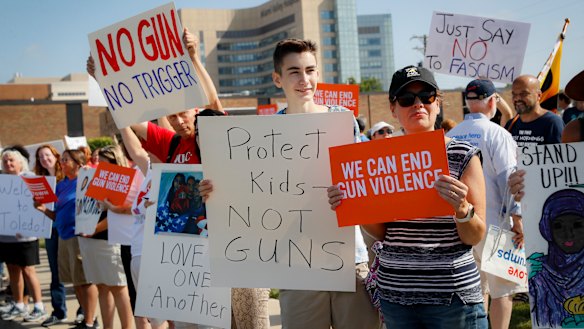 Demonstrators gather to protest the arrival of US President Donald Trump outside Miami Valley Hospital in Ohio. 