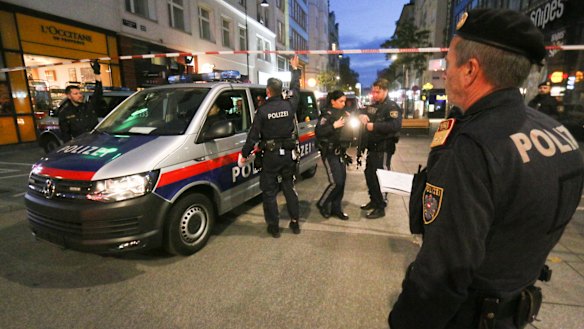 Police patrol the scene near a deadly shooting in Vienna.