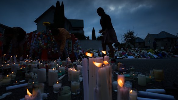 Candles are lit by school children  for the victims of Friday's attacks on Christchurch mosques.