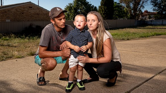 Chris Reynolds (left) and Cassandra Brown-Crane (right) with their two-year-old son Alijah Reynolds the day after he was allegedly left in a bus at a childcare centre. 