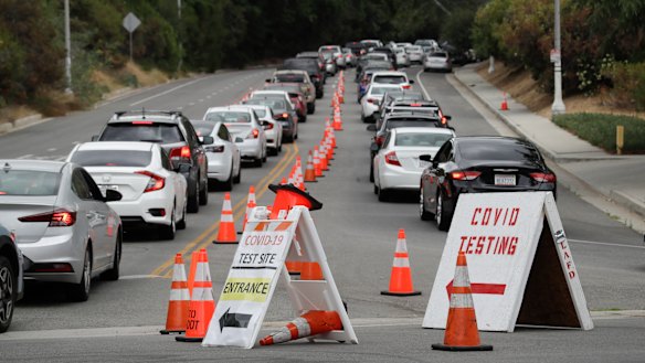 Motorists line up at a coronavirus testing site at Dodger Stadium in Los Angeles on Monday.