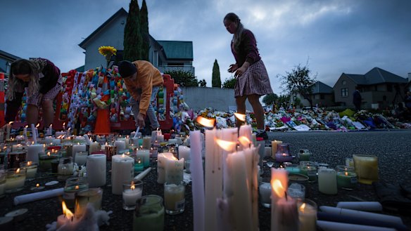 Candles are lit by school children for the victims of Friday's attacks in Christchurch. 