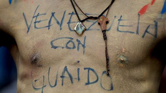'"Venezuela with Guaido": Written on the body.