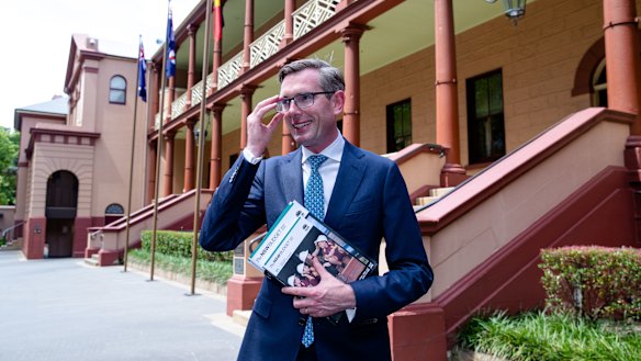 NSW Dominic Perrottet, with the freshly printed budget papers, will deliver the state's biggest deficit in a generation.