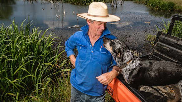 Braidwood farmer Martin Royds, with his dog Mitzy. Mr Royds transformed what was once a dry erosion gully into this functioning waterway.