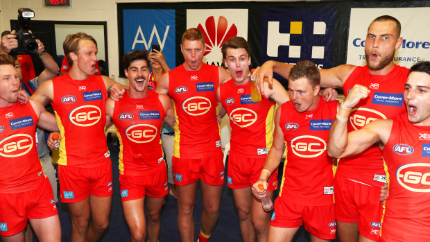 Winners' circle: The Suns sing the song after beating the Bulldogs.