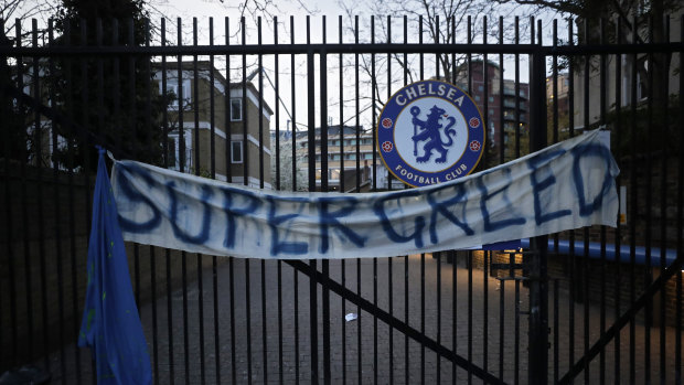 A protest banner hangs from the gates of Chelsea’s ground at Stamford Bridge.