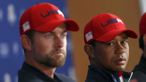 Languishing: Webb Simpson (left) and a weary Tiger Woods after the US lost to Europe in the Ryder Cup.