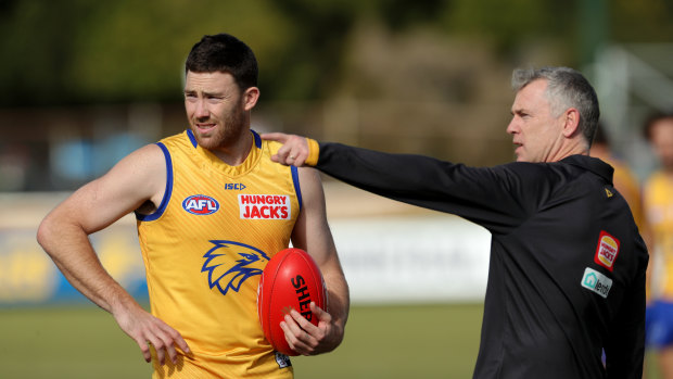 West Coast Eagles coach Adam Simpson directs Jeremy McGovern during a training session.