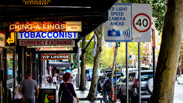 The signage on Oxford Street warning motorists of the 40km/h speed limit is partly obscured by trees.