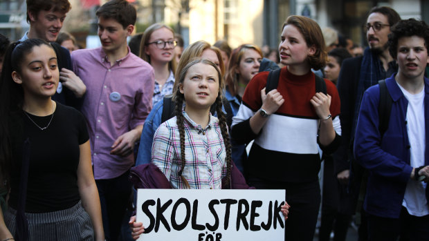 Swedish teenager Greta Thunberg leading a march of thousands of French students through Paris in February. She got there by train. 