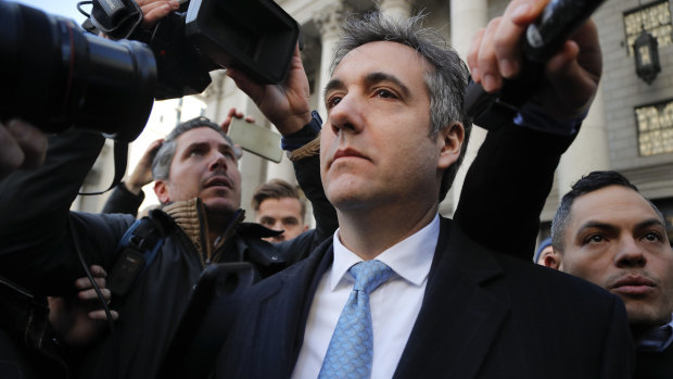 Michael Cohen walks out of federal court.