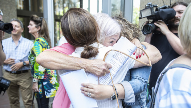 Women hug outside court after the findings in the pelvic mesh judgment were delivered in November 2019.