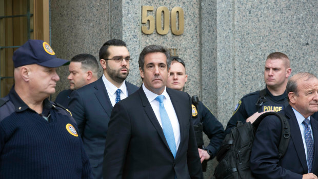 Michael Cohen, centre, President Donald Trump's personal lawyer, leaves federal court in New York last week.