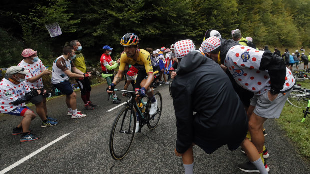 Crowds cheer on Slovenia's Primoz Roglic as he climbs the Marie Blanque pass during the ninth stage of the Tour de France.