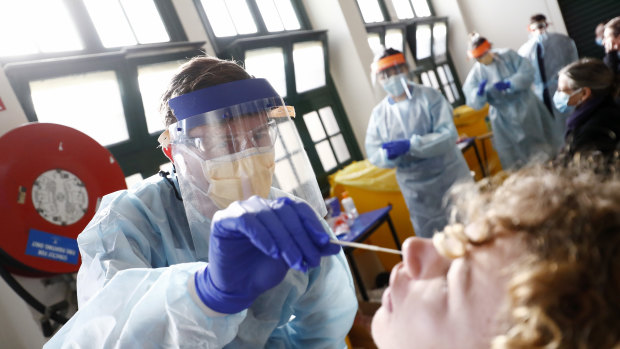 A coronavirus test is conducted at a Royal Melbourne Hospital clinic. 