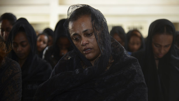 Mourners attend a memorial service held by an association of Ethiopian airline pilots,.