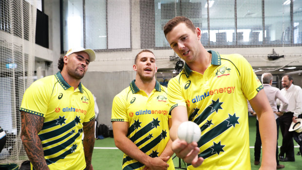 Josh Hazlewood (right), gives some pointers to NRL duo Andrew Fifita (left) and Adam Elliott in Sydney in February.