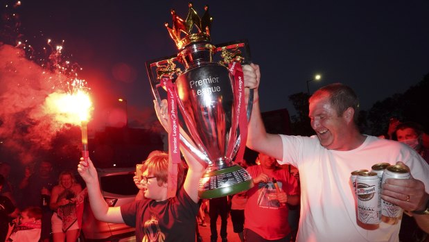 Fans gather outside Anfield as Liverpool celebrate a drought-breaking Premier League crown.
