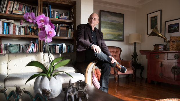 Composer Nigel Westlake with a painting by his sister, Kate, in his Sydney home.