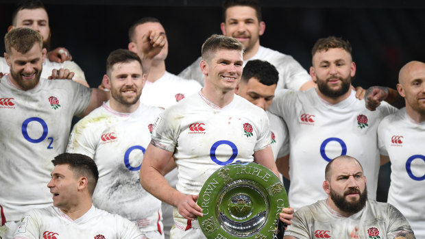England with the Triple Crown trophy from this year's Six Nations tournament, just before it was postponed due to COVID-19. 